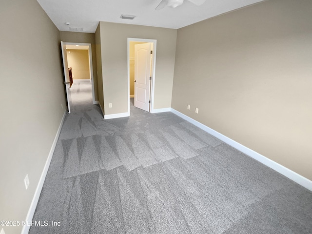 unfurnished bedroom featuring carpet flooring and a spacious closet