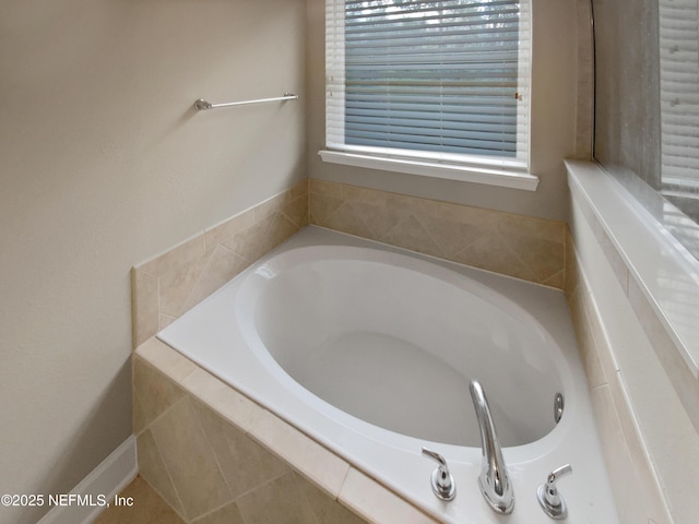 bathroom featuring tiled bath