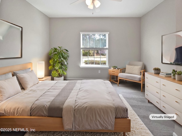 bedroom featuring ceiling fan and carpet floors