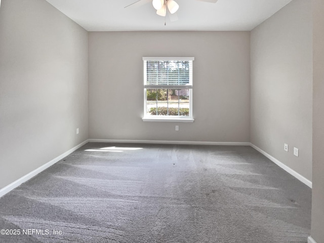 spare room featuring carpet floors and ceiling fan