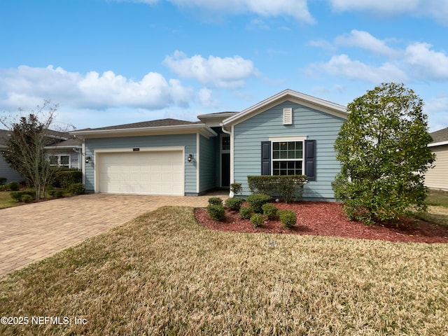 single story home featuring a garage and a front yard