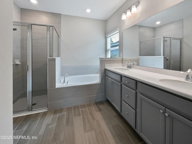 bathroom with vanity and plus walk in shower