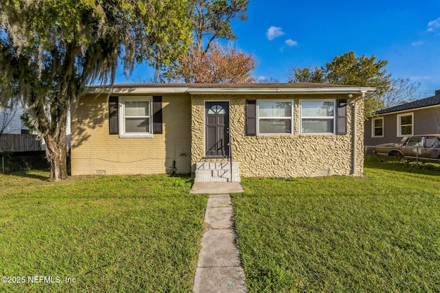 bungalow-style home featuring a front lawn