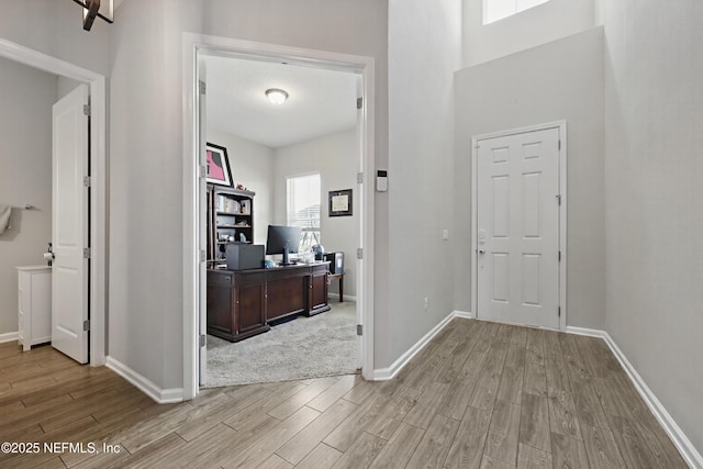 corridor featuring light hardwood / wood-style flooring