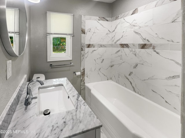 bathroom with vanity and shower / tub combination