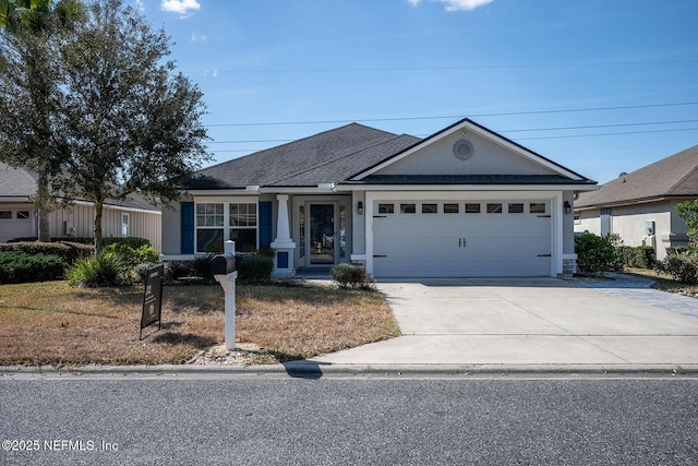 ranch-style house featuring a garage and a front yard