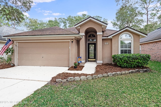 single story home with stucco siding, a garage, roof with shingles, and concrete driveway