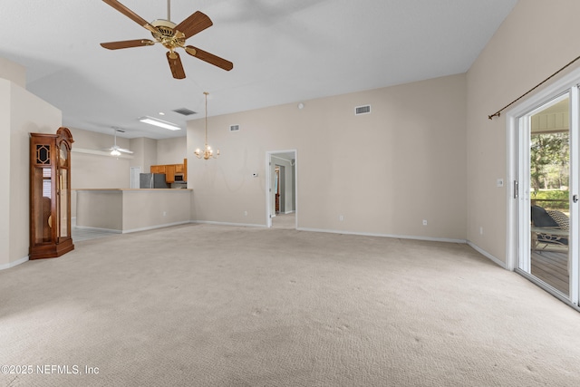 unfurnished living room featuring baseboards, ceiling fan with notable chandelier, visible vents, and light carpet