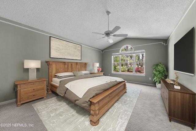 carpeted bedroom featuring ceiling fan, lofted ceiling, baseboards, and a textured ceiling