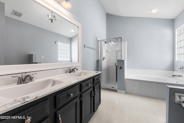 full bathroom with a sink, visible vents, a garden tub, and a stall shower