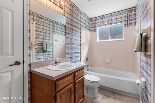 full bathroom featuring vanity, wallpapered walls, tile patterned flooring, a textured ceiling, and toilet