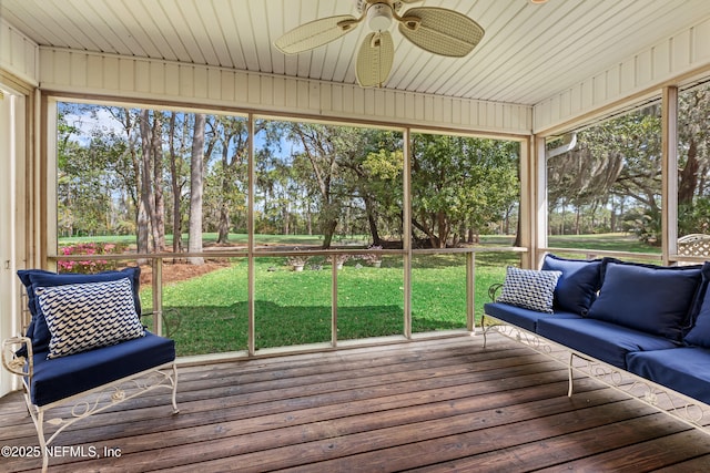 unfurnished sunroom with wooden ceiling and a ceiling fan