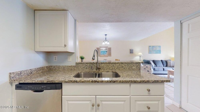 kitchen featuring a sink, white cabinetry, open floor plan, light stone countertops, and dishwasher