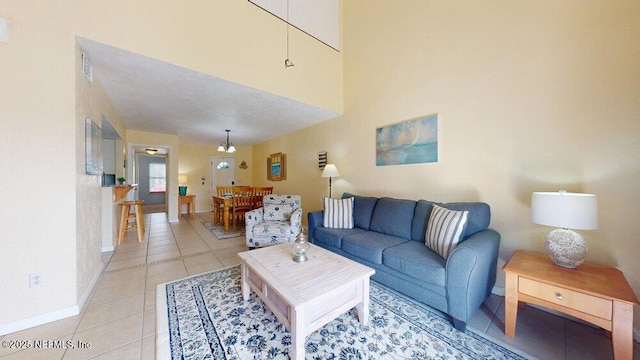 living room with light tile patterned flooring and baseboards