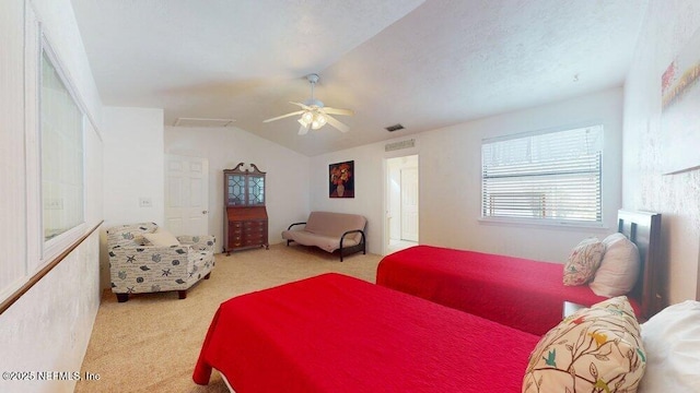 bedroom featuring lofted ceiling, ceiling fan, a textured ceiling, light colored carpet, and visible vents