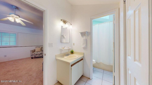 bathroom with toilet, tile patterned floors, ceiling fan, and vanity