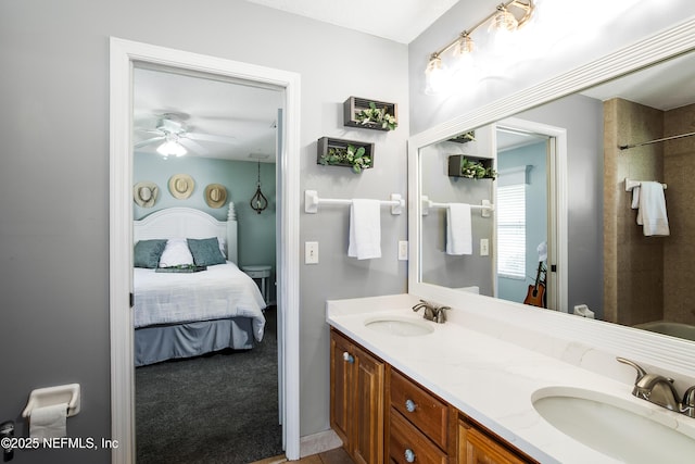 bathroom with vanity, ceiling fan, and washtub / shower combination