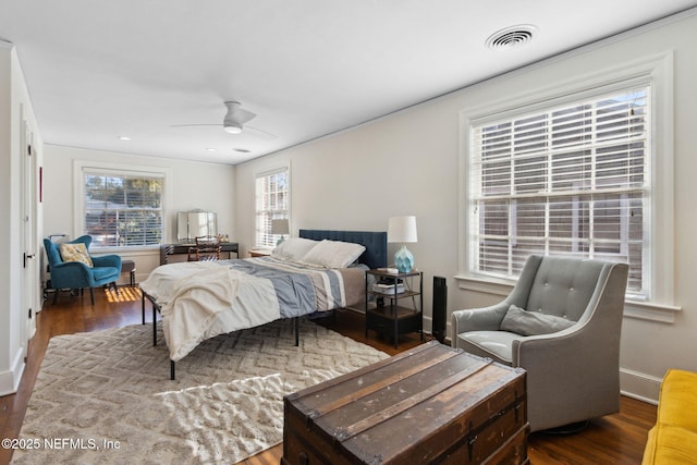 bedroom with ceiling fan and dark hardwood / wood-style floors