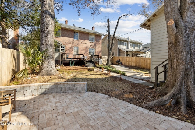 exterior space with a deck and a patio