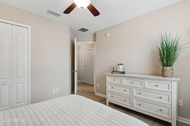 bedroom featuring hardwood / wood-style flooring and ceiling fan