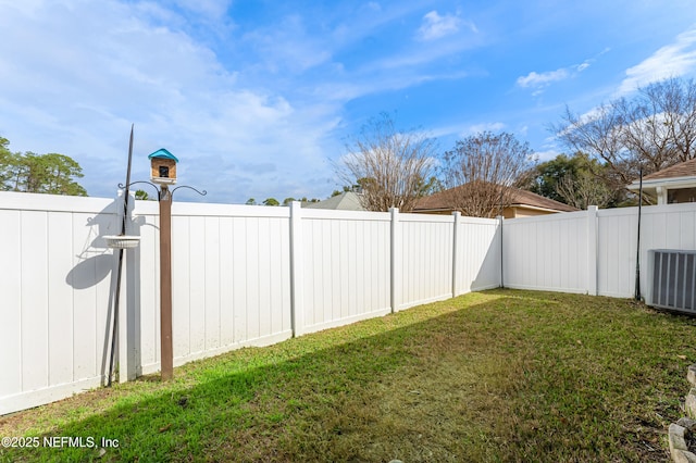 view of yard with central AC