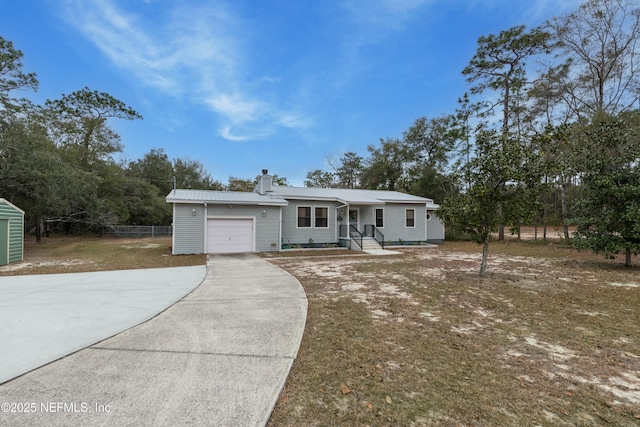 view of front facade with a garage and a front yard