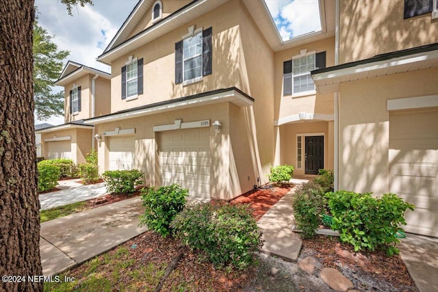 view of front of property with a garage