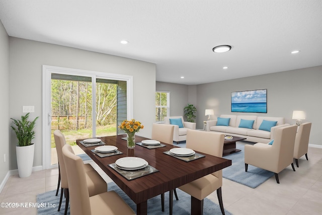 dining room featuring baseboards, light tile patterned floors, and recessed lighting