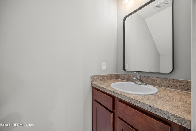 bathroom with vanity and visible vents