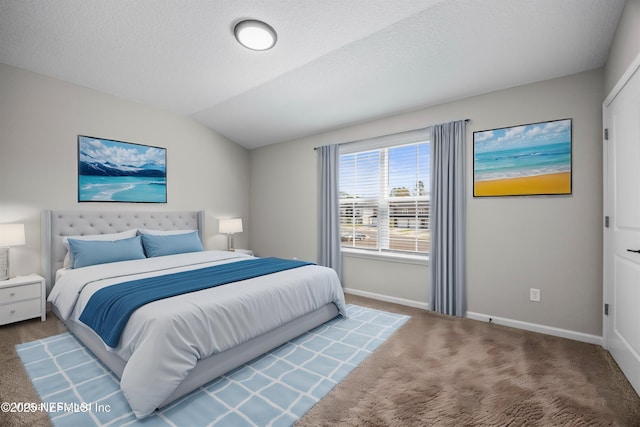 carpeted bedroom featuring lofted ceiling, a textured ceiling, and baseboards