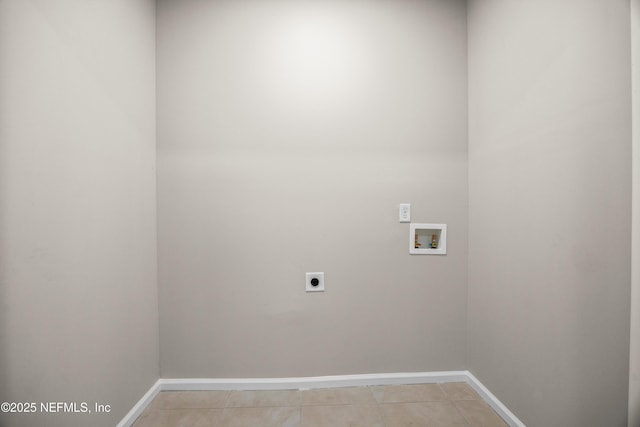 clothes washing area featuring light tile patterned floors, laundry area, washer hookup, baseboards, and electric dryer hookup