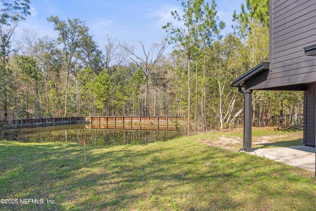 view of yard with a forest view