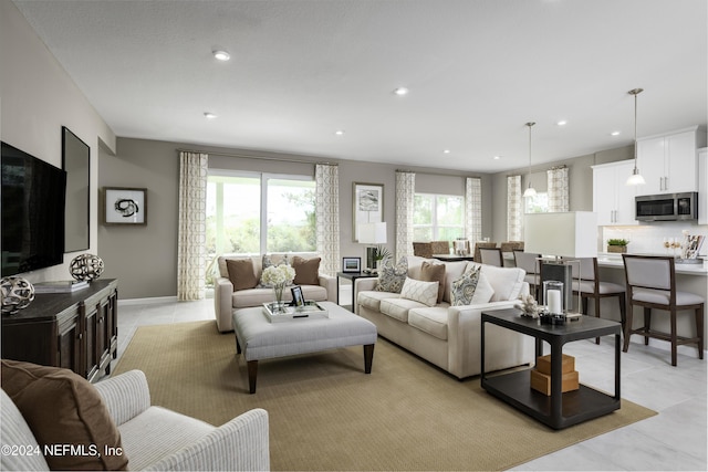 tiled living room with a wealth of natural light