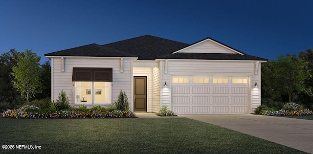 view of front of home featuring a garage and a front yard