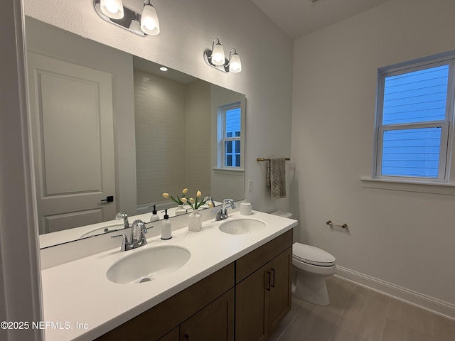 bathroom featuring toilet and vanity