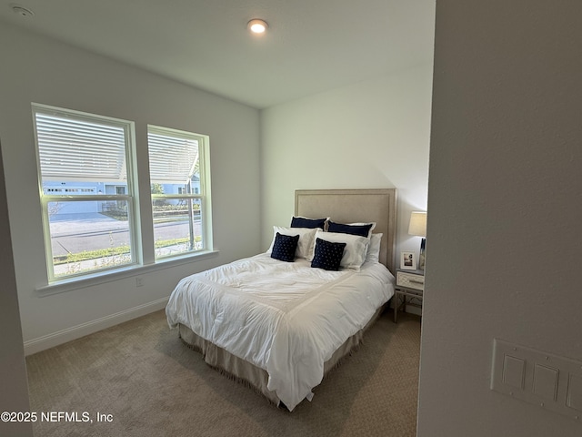 bedroom featuring light carpet