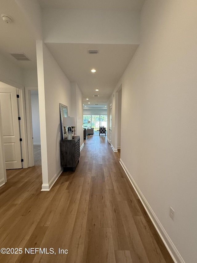 corridor featuring light hardwood / wood-style flooring