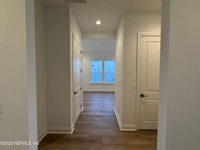 hallway featuring hardwood / wood-style floors