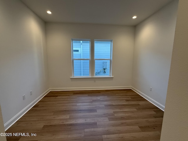 unfurnished room featuring hardwood / wood-style floors