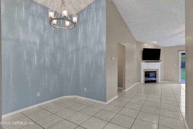 unfurnished dining area featuring a notable chandelier, vaulted ceiling, and light tile patterned floors