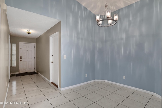 unfurnished dining area featuring a notable chandelier and light tile patterned floors