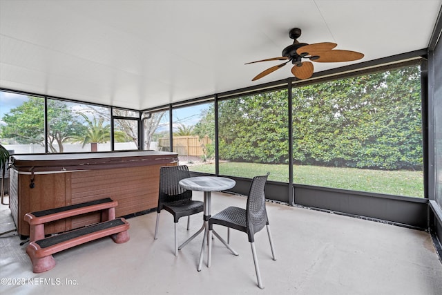 sunroom with a ceiling fan