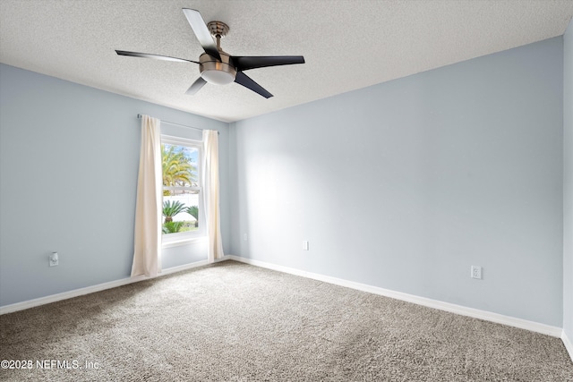 unfurnished room featuring baseboards, carpet floors, a textured ceiling, and a ceiling fan