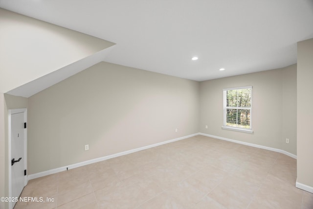 bonus room featuring recessed lighting, light tile patterned flooring, and baseboards