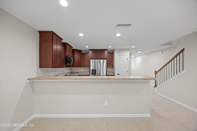 kitchen with recessed lighting, light countertops, visible vents, a peninsula, and stainless steel fridge with ice dispenser