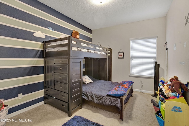 carpeted bedroom featuring a textured ceiling