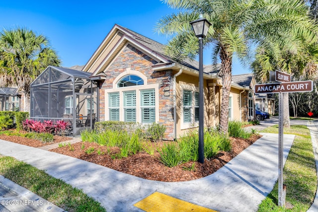 view of front of property with glass enclosure