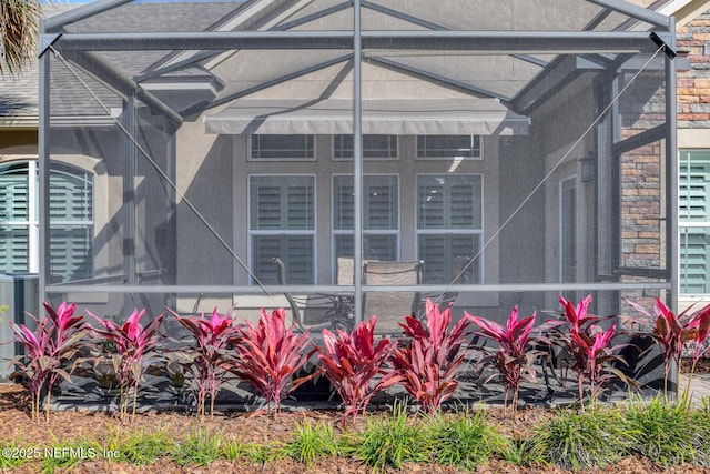 exterior space featuring central AC and a lanai