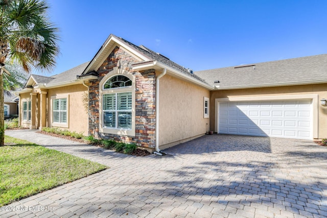 view of side of property with a garage