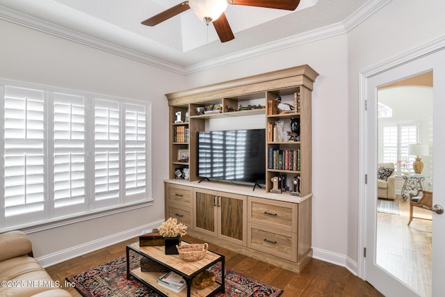 living room featuring crown molding, dark hardwood / wood-style floors, and ceiling fan